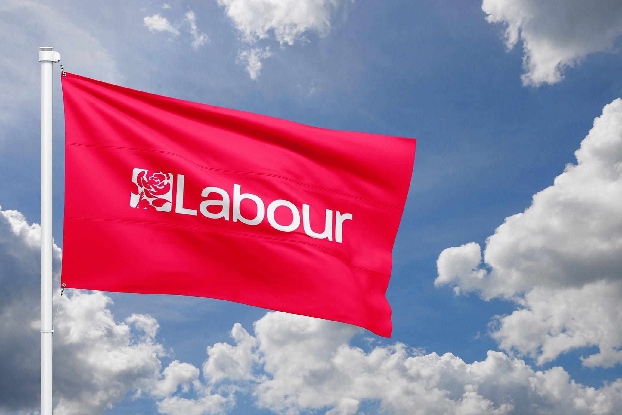 Labour Party flag against a blue sky