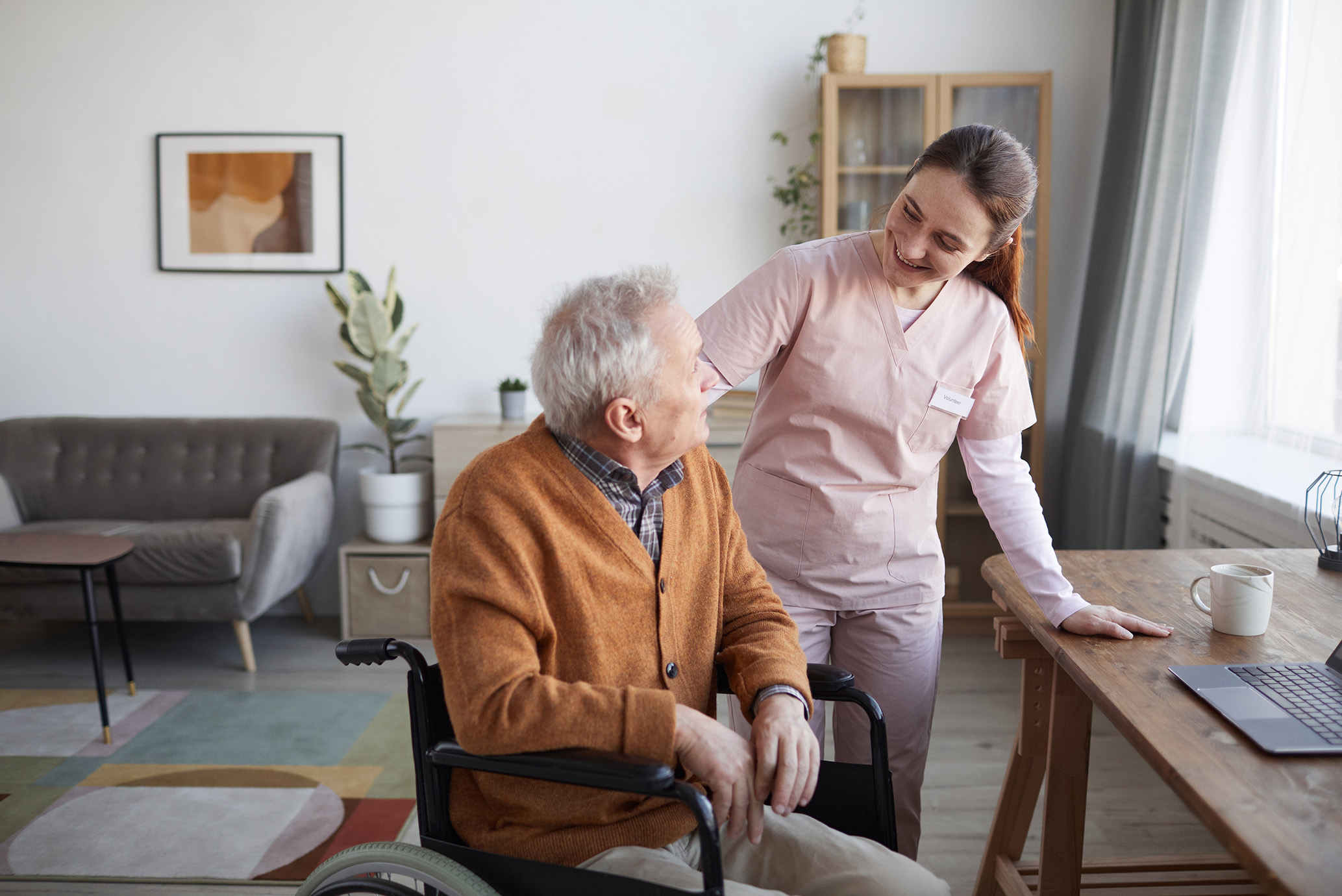 Elderly man with a care worker